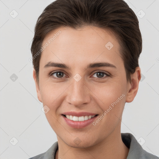 Joyful white young-adult female with short  brown hair and brown eyes