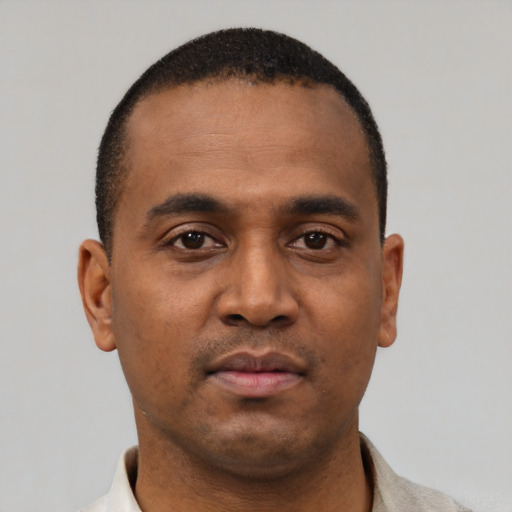 Neutral black young-adult male with short  black hair and brown eyes
