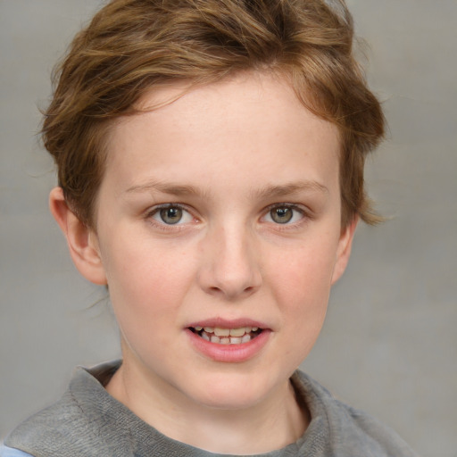 Joyful white child female with short  brown hair and blue eyes