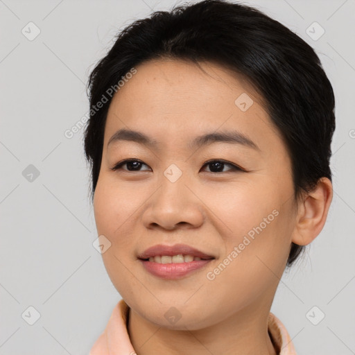 Joyful asian young-adult female with medium  brown hair and brown eyes