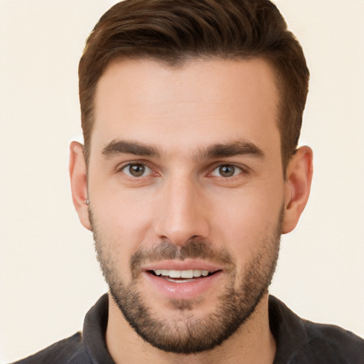 Joyful white young-adult male with short  brown hair and brown eyes