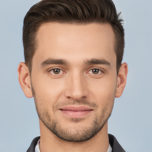 Joyful white young-adult male with short  brown hair and brown eyes