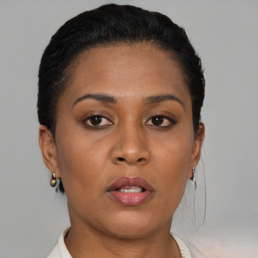 Neutral black young-adult female with short  brown hair and brown eyes