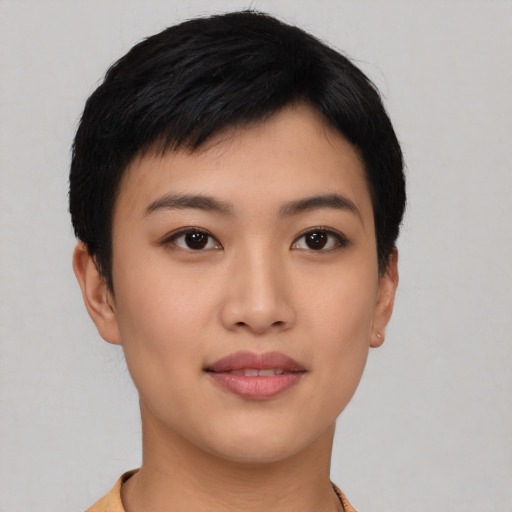 Joyful asian young-adult female with short  black hair and brown eyes