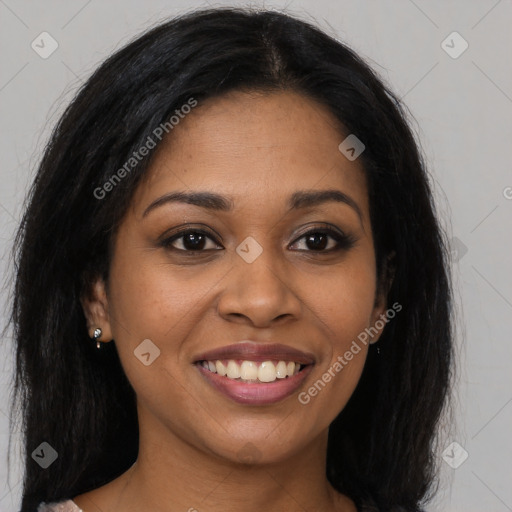 Joyful black young-adult female with long  brown hair and brown eyes