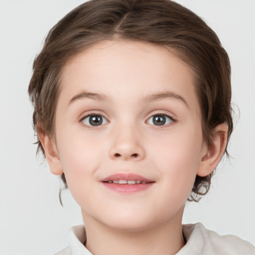 Joyful white child female with medium  brown hair and brown eyes