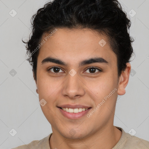 Joyful latino young-adult male with short  brown hair and brown eyes