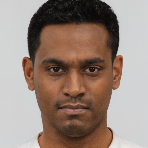 Neutral black young-adult male with short  black hair and brown eyes