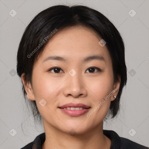 Joyful asian young-adult female with medium  black hair and brown eyes