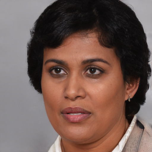 Joyful asian adult female with short  brown hair and brown eyes
