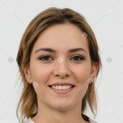 Joyful white young-adult female with medium  brown hair and grey eyes