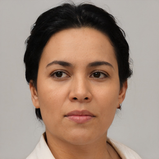 Neutral latino adult female with short  black hair and brown eyes