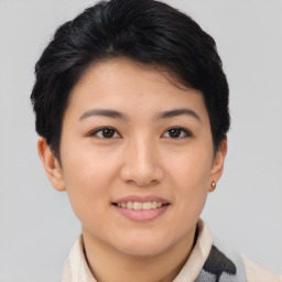 Joyful asian young-adult female with short  brown hair and brown eyes