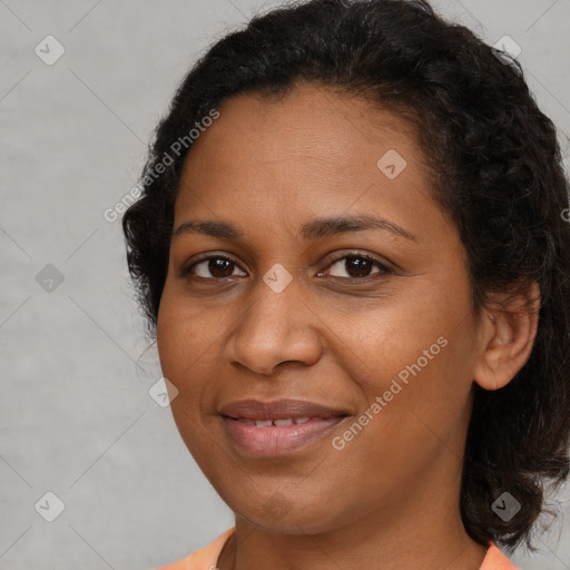 Joyful black young-adult female with medium  brown hair and brown eyes