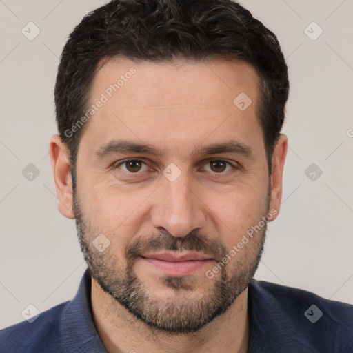 Joyful white young-adult male with short  black hair and brown eyes