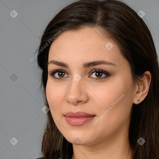 Joyful white young-adult female with long  brown hair and brown eyes