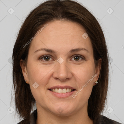 Joyful white adult female with medium  brown hair and brown eyes