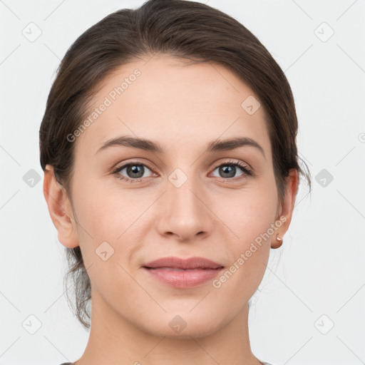 Joyful white young-adult female with medium  brown hair and grey eyes