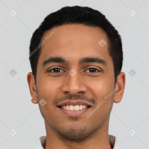 Joyful latino young-adult male with short  black hair and brown eyes