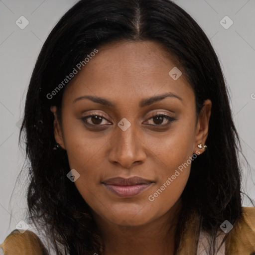 Joyful black young-adult female with long  brown hair and brown eyes