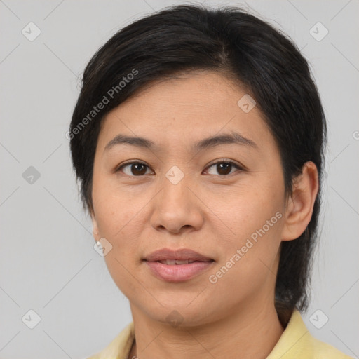 Joyful asian young-adult female with medium  brown hair and brown eyes