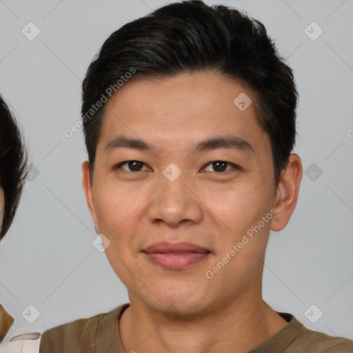 Joyful white young-adult male with short  brown hair and brown eyes