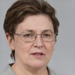 Joyful white middle-aged female with short  brown hair and grey eyes