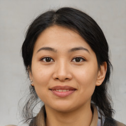 Joyful asian young-adult female with medium  black hair and brown eyes