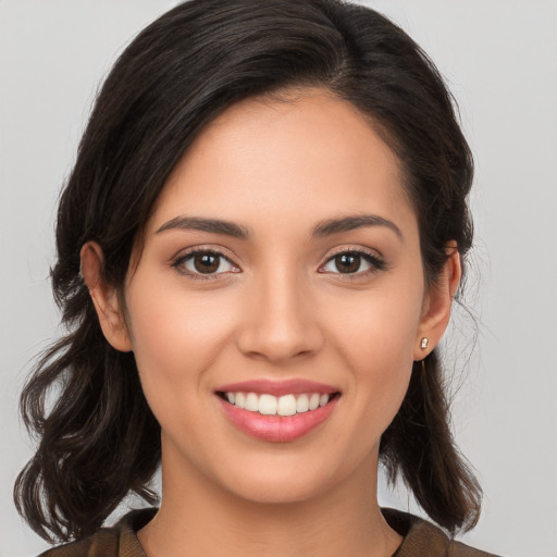 Joyful white young-adult female with medium  brown hair and brown eyes