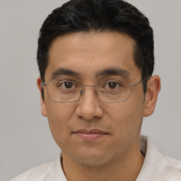 Neutral white adult male with short  black hair and brown eyes