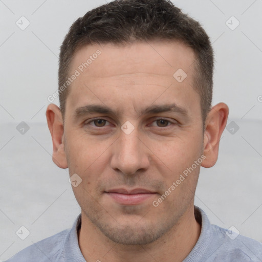 Joyful white adult male with short  brown hair and brown eyes