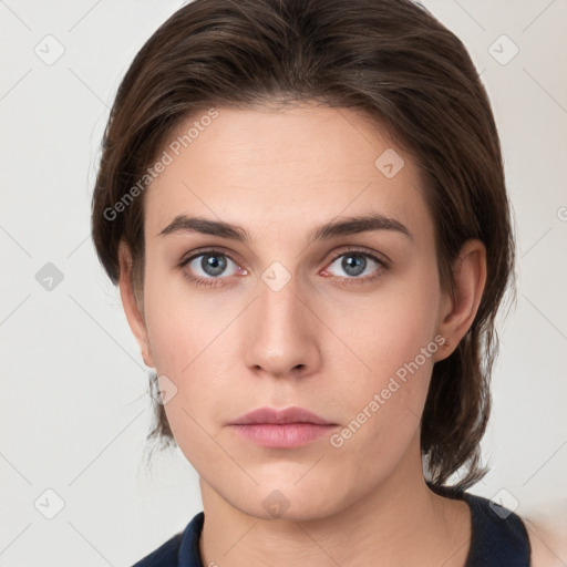 Neutral white young-adult female with medium  brown hair and grey eyes