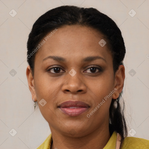 Joyful black adult female with short  brown hair and brown eyes
