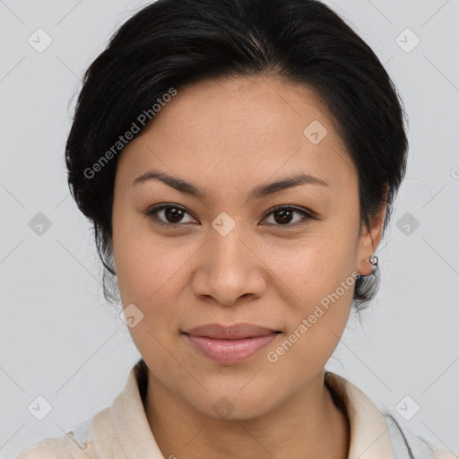 Joyful latino young-adult female with medium  brown hair and brown eyes