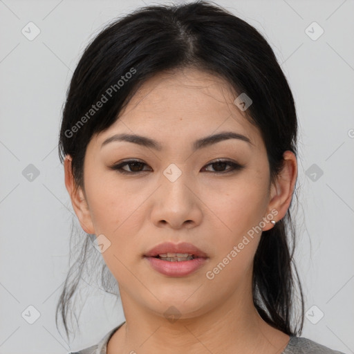 Joyful asian young-adult female with medium  black hair and brown eyes