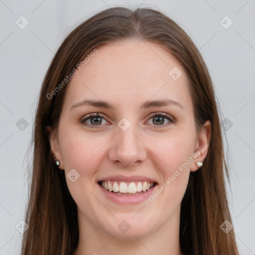 Joyful white young-adult female with long  brown hair and grey eyes