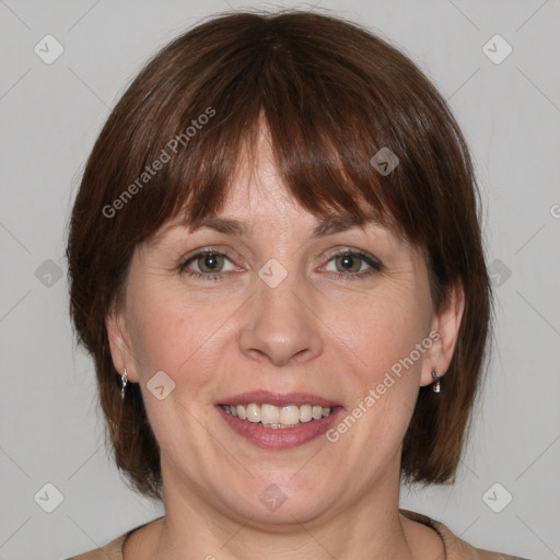 Joyful white adult female with medium  brown hair and grey eyes