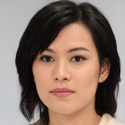 Neutral asian young-adult female with medium  brown hair and brown eyes