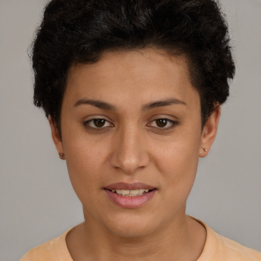 Joyful white young-adult female with short  brown hair and brown eyes