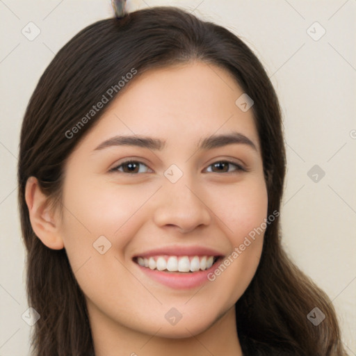 Joyful white young-adult female with long  brown hair and brown eyes