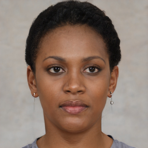 Neutral black young-adult female with short  black hair and brown eyes