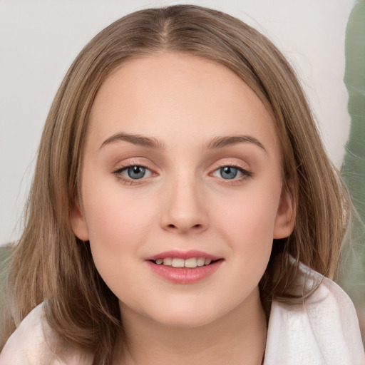 Joyful white child female with long  brown hair and grey eyes