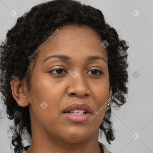 Joyful black young-adult female with long  brown hair and brown eyes