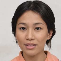 Joyful asian young-adult female with medium  brown hair and brown eyes