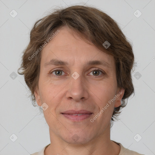 Joyful white adult female with short  brown hair and brown eyes