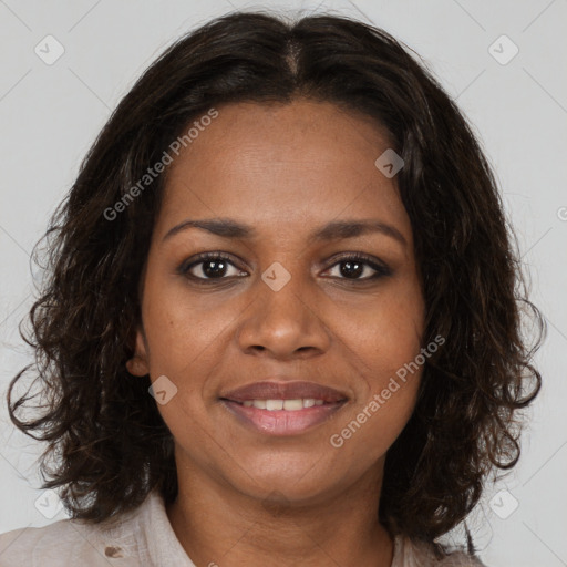 Joyful black young-adult female with medium  brown hair and brown eyes