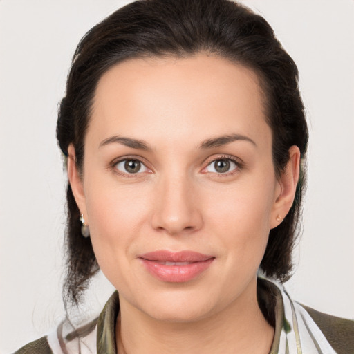 Joyful white young-adult female with medium  brown hair and brown eyes