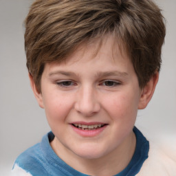 Joyful white child male with short  brown hair and grey eyes