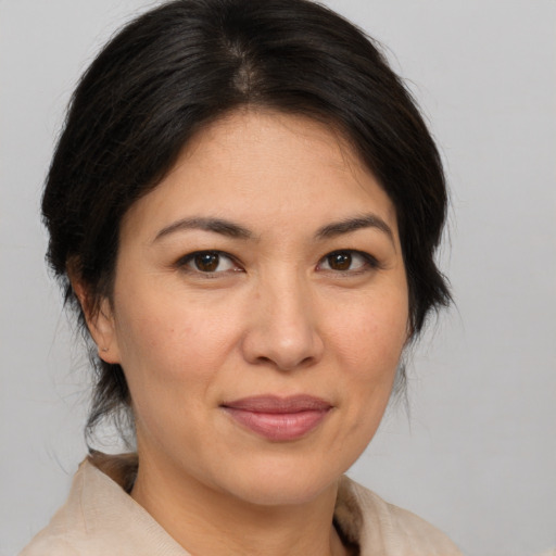 Joyful white adult female with medium  brown hair and brown eyes