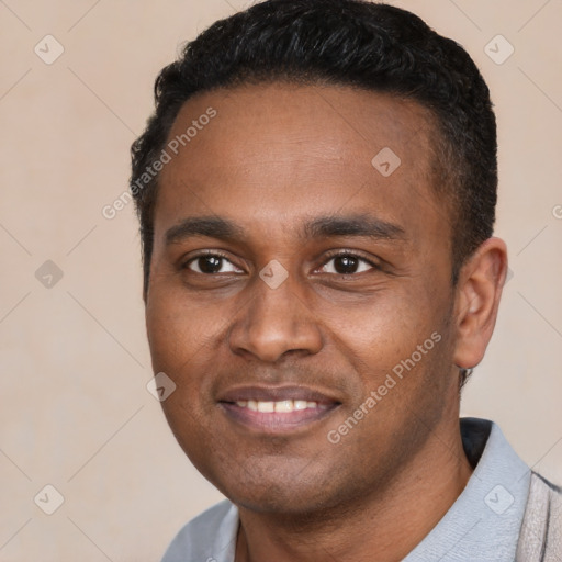 Joyful latino young-adult male with short  black hair and brown eyes